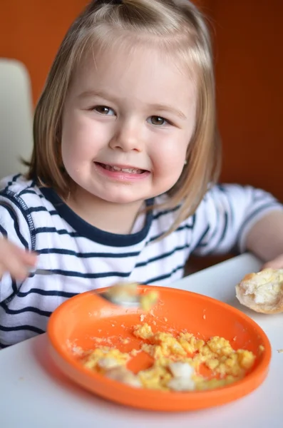 The baby girl is eating — Stock Photo, Image