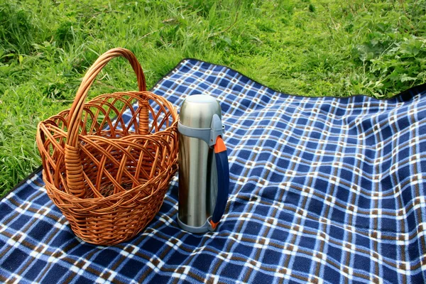 stock image Basket, thermos and picnic blanket