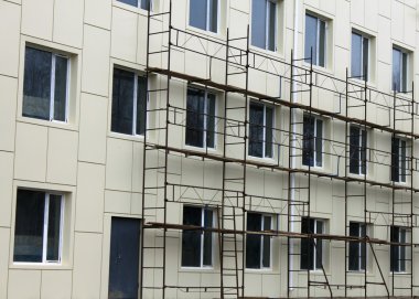 Scaffold against the wall and windows clipart