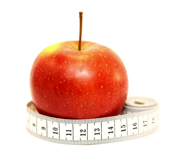 Manzana roja fresca con cinta métrica —  Fotos de Stock