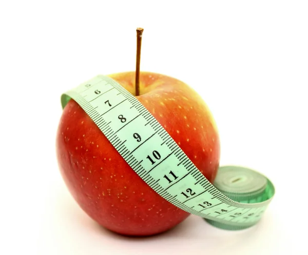 Fresh red apple with measuring tape — Stock Photo, Image