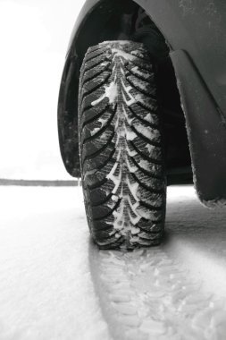 Winter tires in the snow clipart