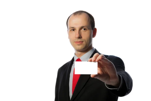Businessman holding a blank business card, horizontal, isolated — Stock Photo, Image