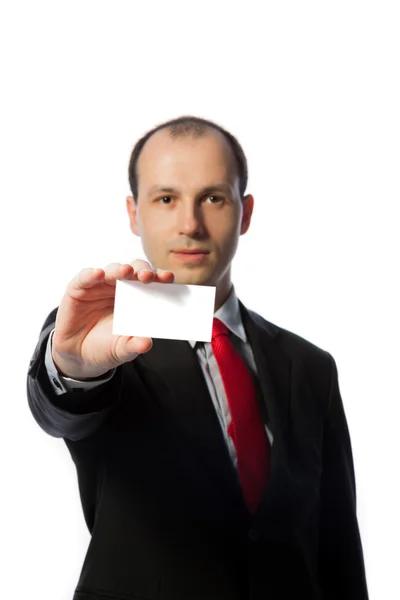 Businessman holding a blank business card, vertical, isolated — Stock Photo, Image