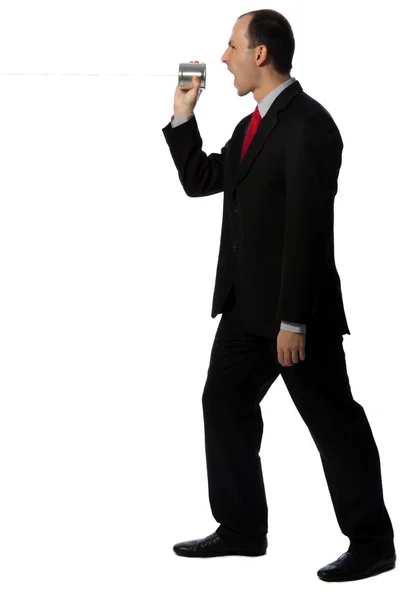 Businessman yelling through an oldschool can phone — Stock Photo, Image