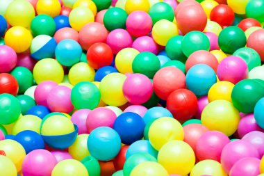 Colorful balls in a playground for kids clipart