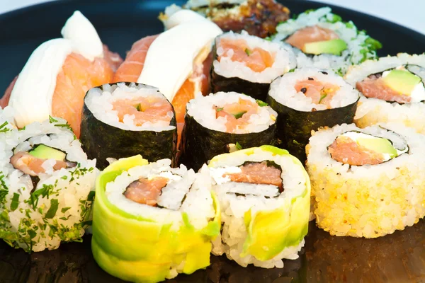 stock image Sushi set in a black plate close up