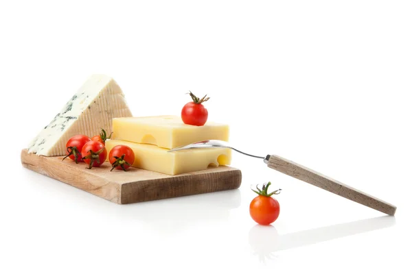 Blue and hard cheese decorated with coctail tomatoes — Stock Photo, Image