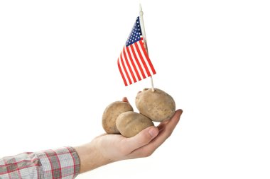 American farmer proudly showing his crops clipart