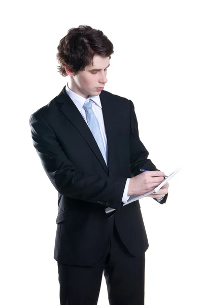 Stock image Young businessman making notes