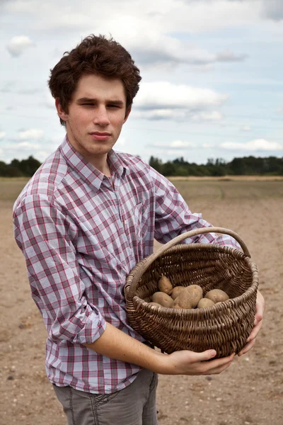 stock image Young agriculturist showing his crops