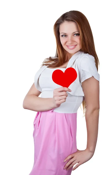 Sorridente giovane donna in possesso di un cuore — Foto Stock