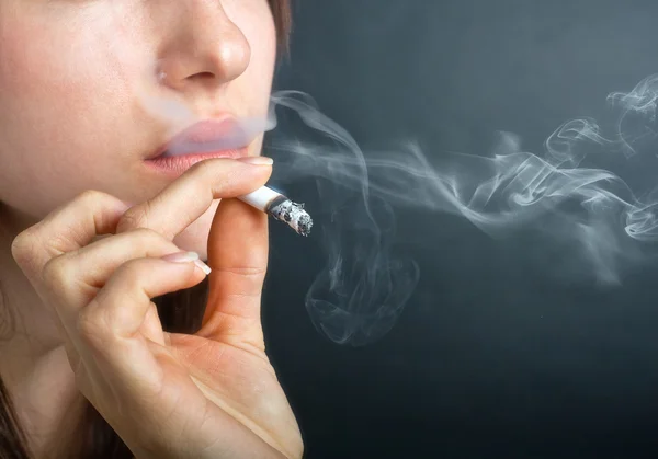 Woman Exhaling Smoke — Stock Photo, Image