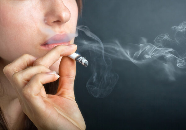 Woman Exhaling Smoke