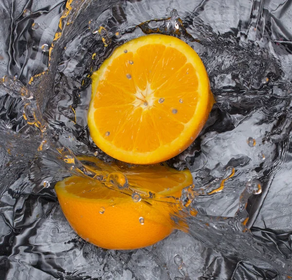 stock image Orange and splashing water