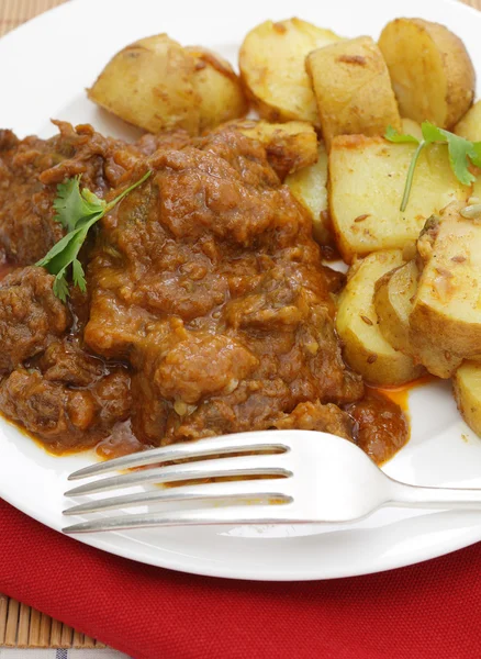 Beef madras and potato curry — Stock Photo, Image