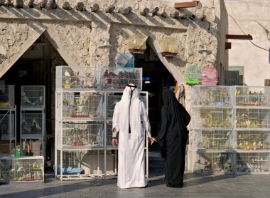 Qatari couple in bird souq clipart