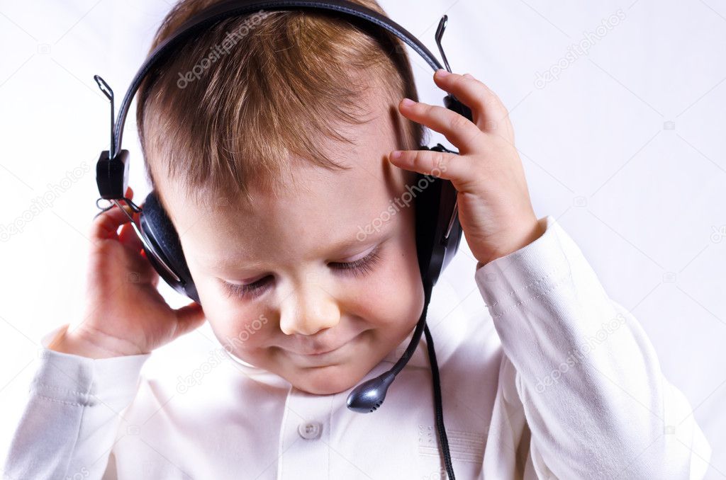 Young boy wearing telephone headset