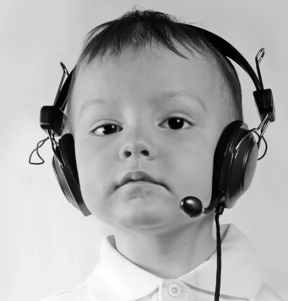 Little boy wearing telephone headset — Stock Photo, Image