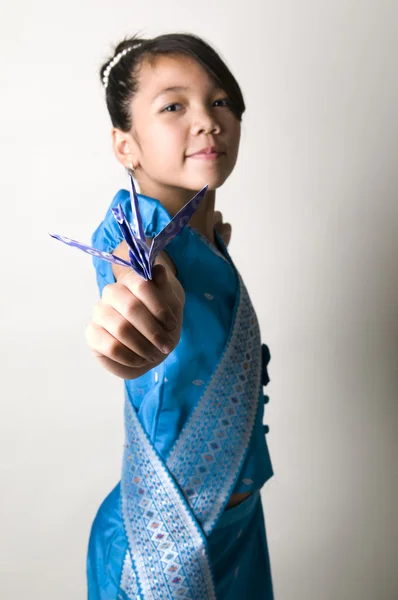 Asian girl holding origami bird — Stock Photo, Image