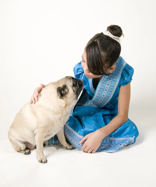 Pug and girl giving each other a kiss — Stock Photo, Image