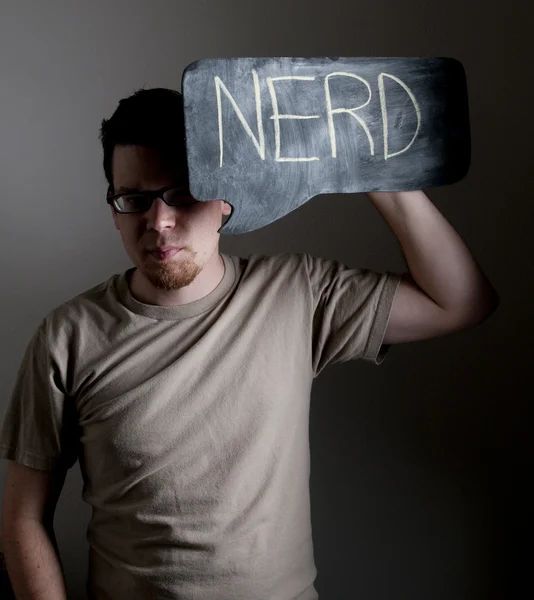 Αρσενικό κρατάει πινακίδα nerd — Φωτογραφία Αρχείου