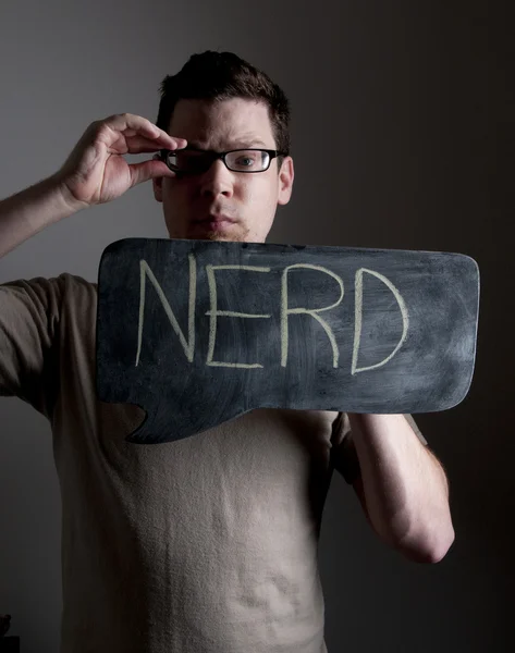 Αρσενικό κρατάει πινακίδα nerd — Φωτογραφία Αρχείου