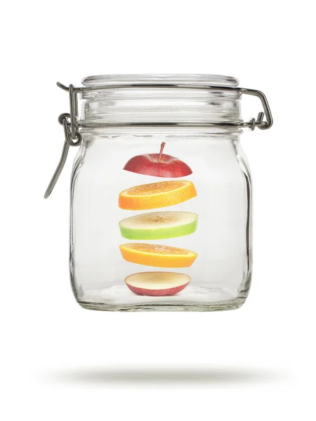 Fruta levitante en frasco de vidrio — Foto de Stock