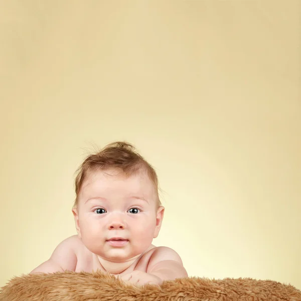 Adorable baby on fur blanket — Stock Photo, Image