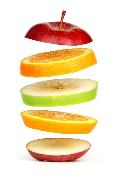 Levitating fresh sliced fruit — Stock Photo, Image