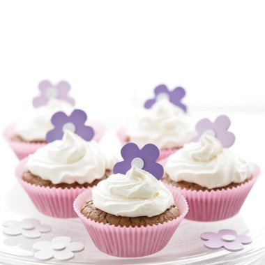 Delicious cupcakes with sweet cream clipart