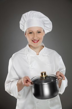 Young female chef with pot clipart