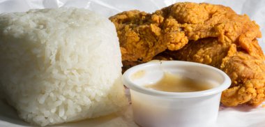Fried chicken with steamed rice anad gravy clipart