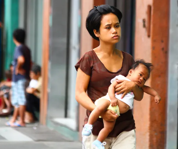 Матери-подростки / Одинокие мамы в Азии Стоковое Фото