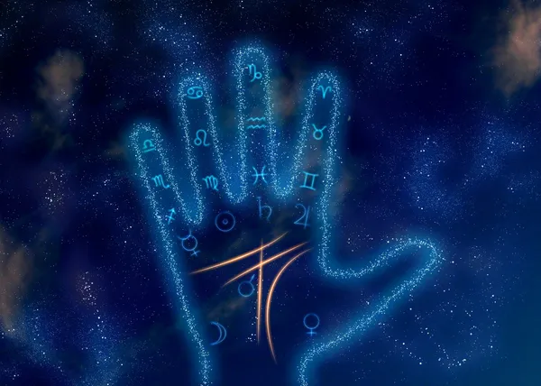 Светящаяся ладонь с астрологическими символами на космическом фоне — стоковое фото