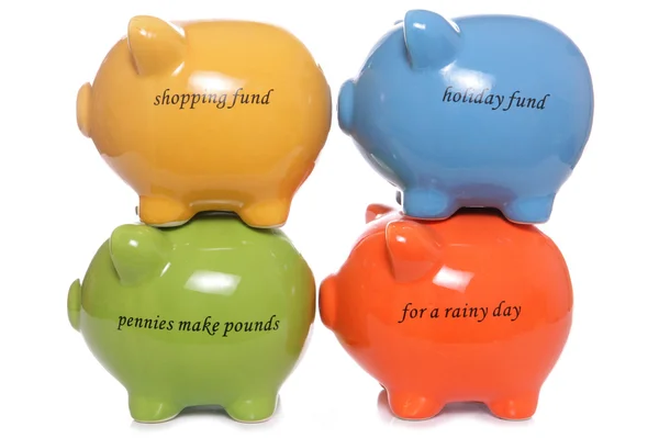Four Piggy banks stacked — Stock Photo, Image