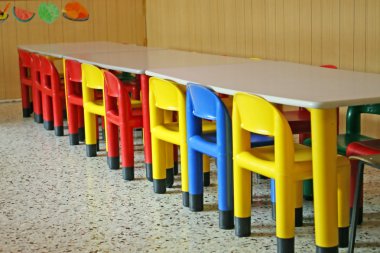 Empty chairs in a dining room clipart