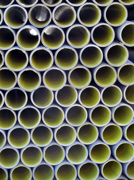 Yellow corrugated tube for the laying of ducts — Stock Photo, Image