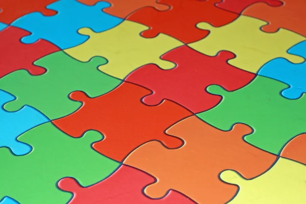 Kolorowe kawałki skomplikowane puzzle — Zdjęcie stockowe
