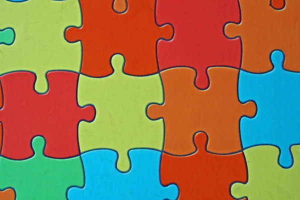 Kolorowe kawałki skomplikowane puzzle używane — Zdjęcie stockowe
