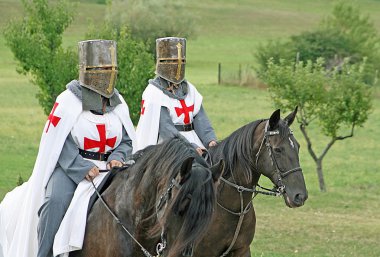 Two medieval crusaders shall strutting clipart