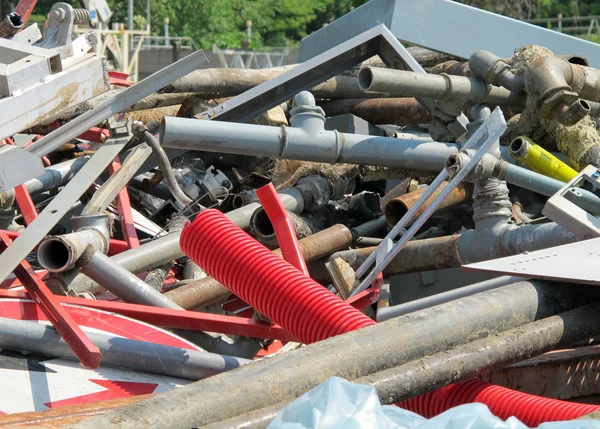 Pipes and irons in a landfill of old iron — Stock Photo, Image