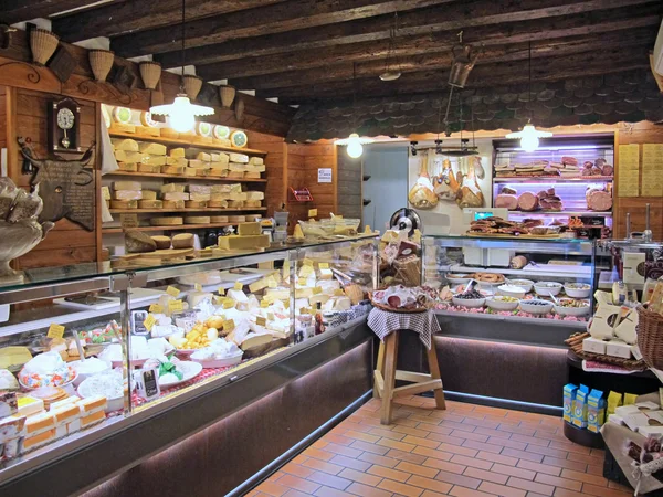 Interior of a shop selling cheeses and sausages — Stock Photo, Image