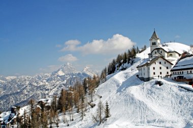 Remote mountain village in winter clipart