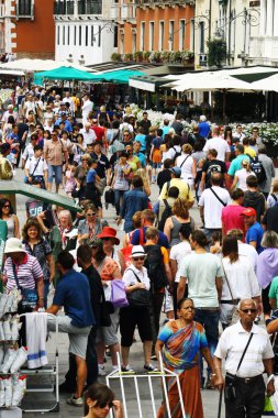 Crowds of tourists along the Grand Canal in Venice clipart