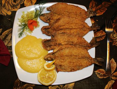 Reshwater fish fry served at Italian restaurant clipart