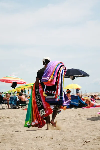 Hawker beach towels on the beach in the sand — Stock Photo, Image