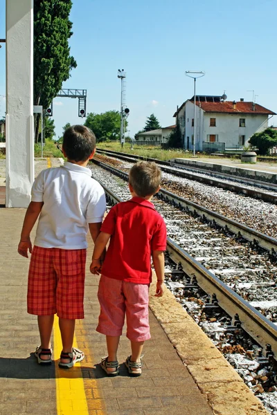 stock image Two brothers, children waiting for the train station