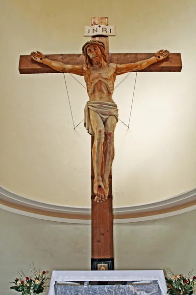 Interior of an Italian church with a big wooden cross — Stock Photo, Image