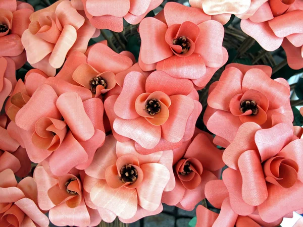 Pink wooden flowers handmade in retail market